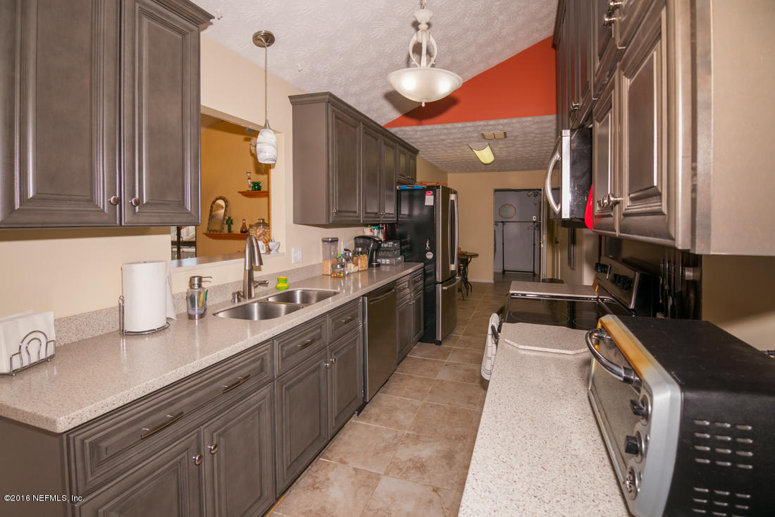 12594 Agatite Road Jacksonville, FL 32258 - Photo 17 of 49 a kitchen with lots of counter top space