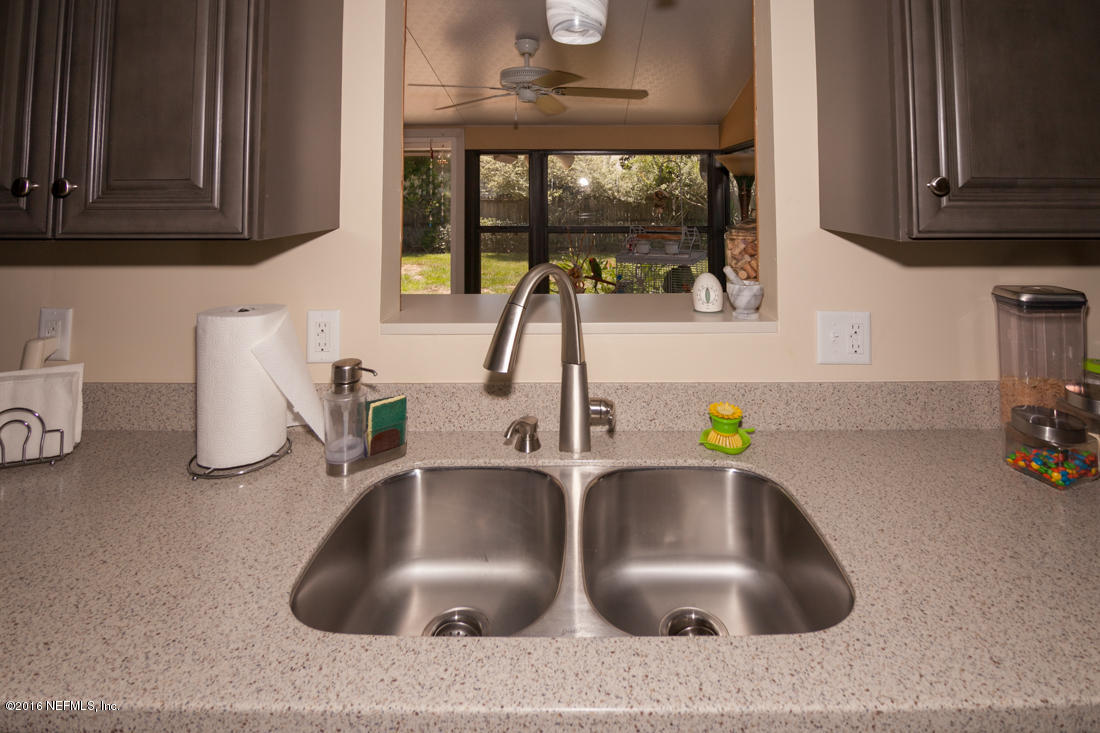 12594 Agatite Road Jacksonville, FL 32258 - Photo 19 of 49 a kitchen with sink and a window