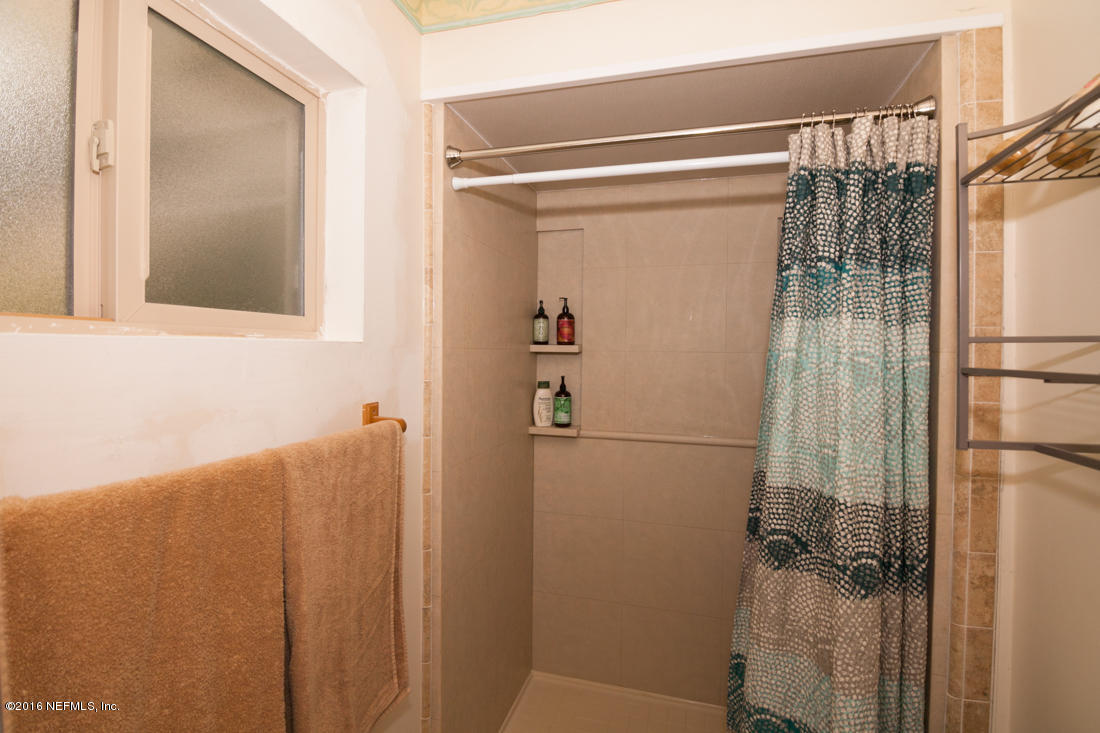 12594 Agatite Road Jacksonville, FL 32258 - Photo 24 of 49 a bathroom with a shower