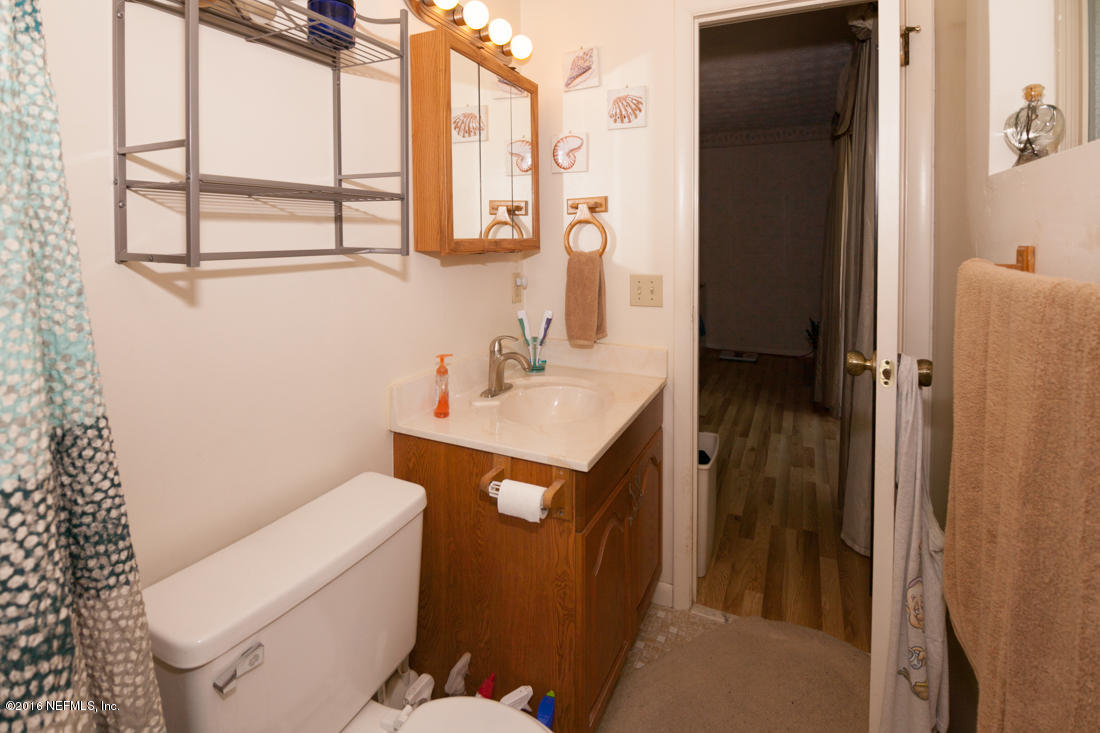 12594 Agatite Road Jacksonville, FL 32258 - Photo 25 of 49 a bathroom with a sink toilet and shower