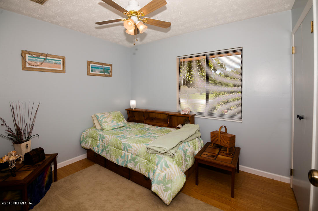 12594 Agatite Road Jacksonville, FL 32258 - Photo 28 of 49 a bedroom with a bed and a window