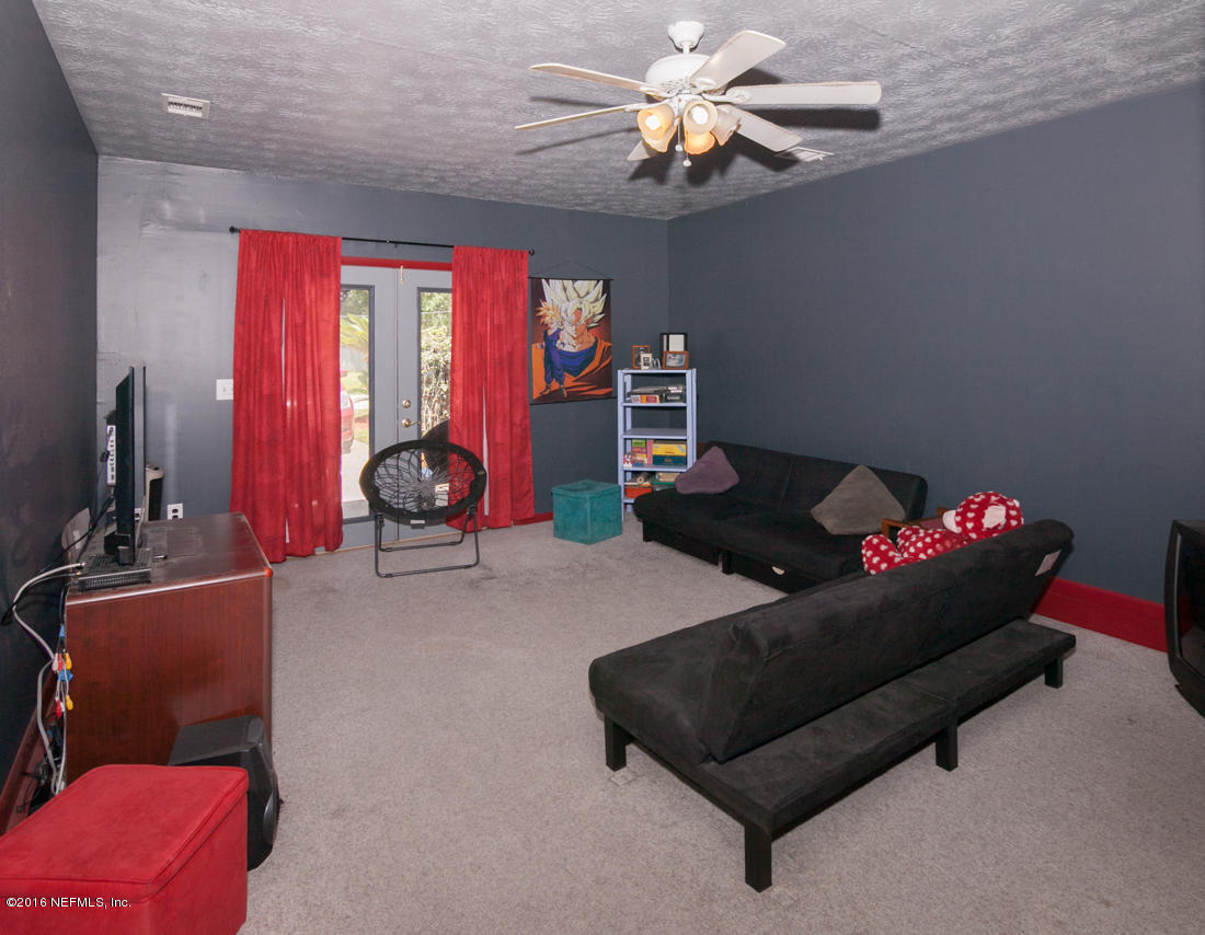 12594 Agatite Road Jacksonville, FL 32258 - Photo 29 of 49 a living room with furniture a air conditioner vent and a window