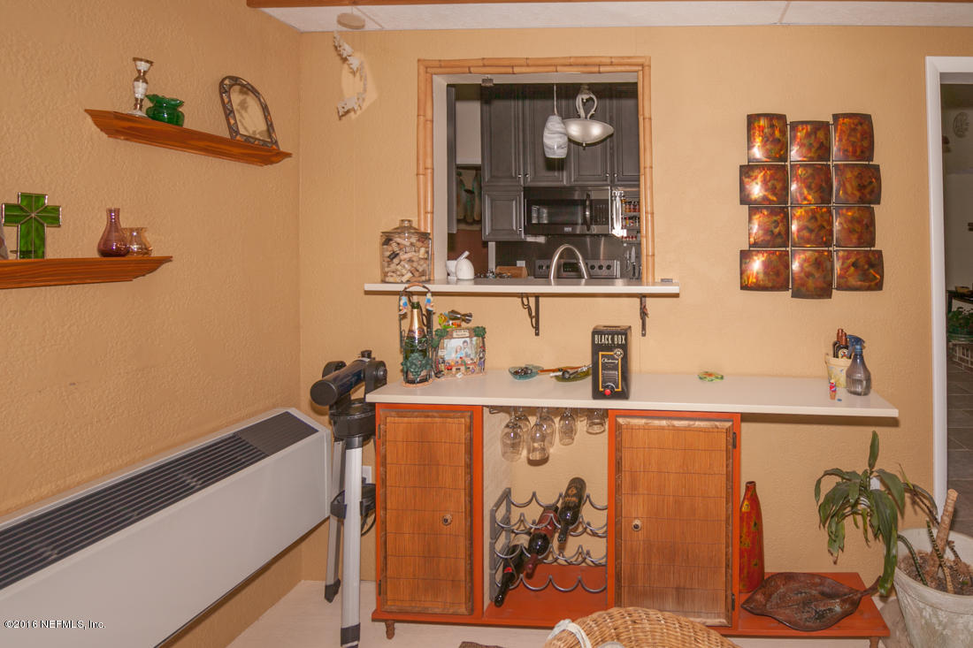 12594 Agatite Road Jacksonville, FL 32258 - Photo 34 of 49 a room with a mirror and cabinets