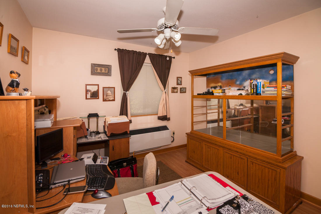 12594 Agatite Road Jacksonville, FL 32258 - Photo 36 of 49 a workspace with furniture