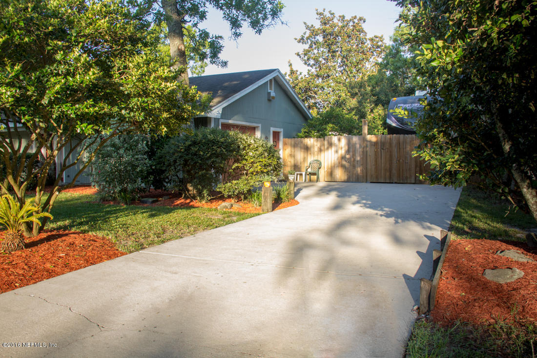 12594 Agatite Road Jacksonville, FL 32258 - Photo 40 of 49 a front view of a house with a yard and garage