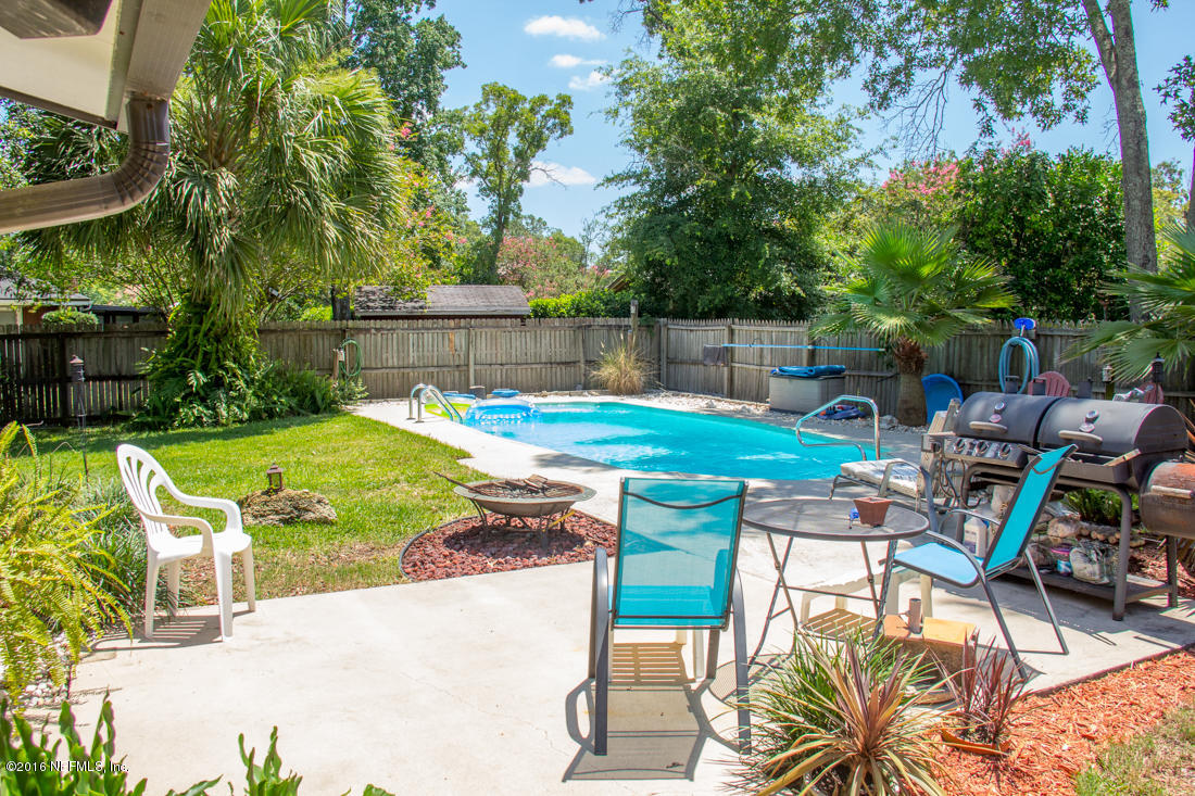 12594 Agatite Road Jacksonville, FL 32258 - Photo 42 of 49 a view of a backyard with swimming pool