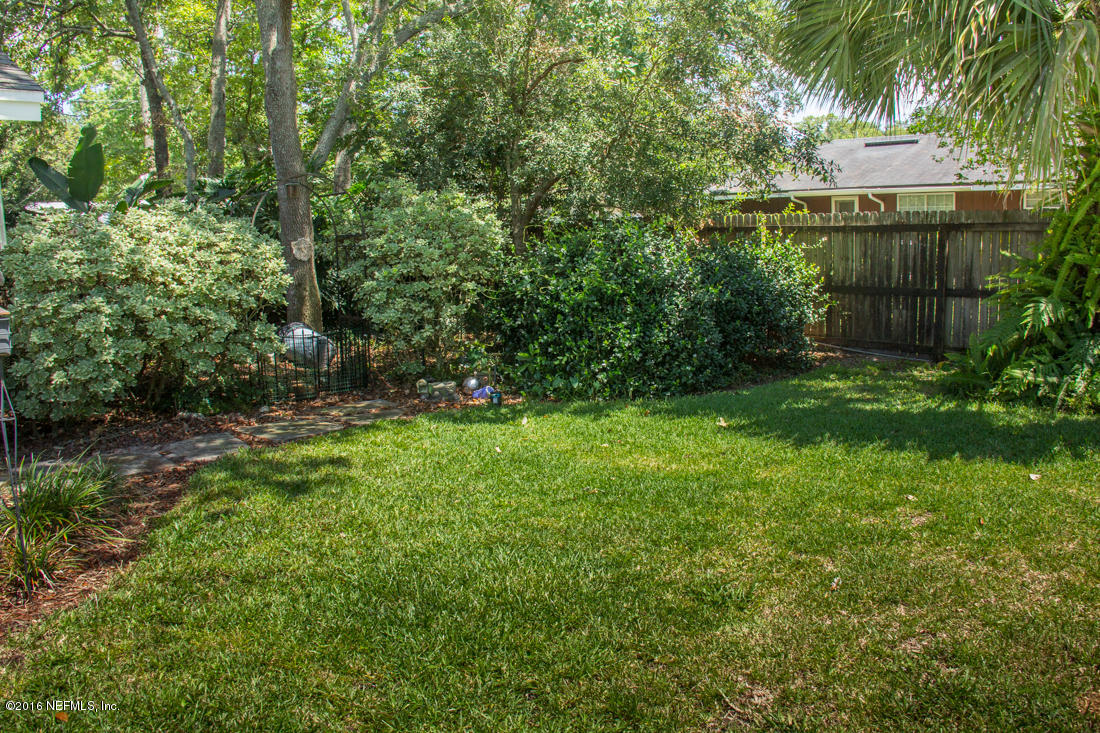 12594 Agatite Road Jacksonville, FL 32258 - Photo 46 of 49 a view of a tiny house with a yard