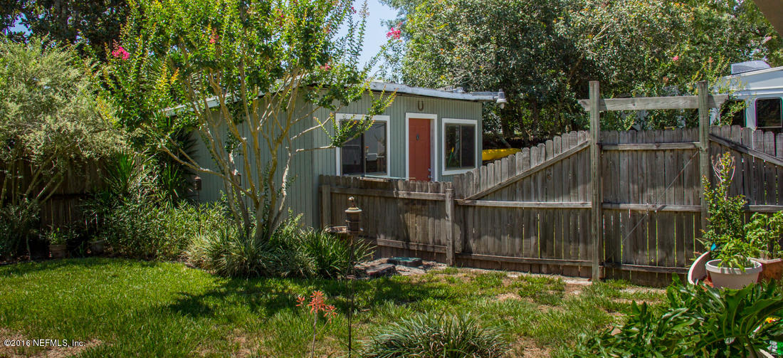 12594 Agatite Road Jacksonville, FL 32258 - Photo 47 of 49 a backyard of a house with lots of green space and fountain