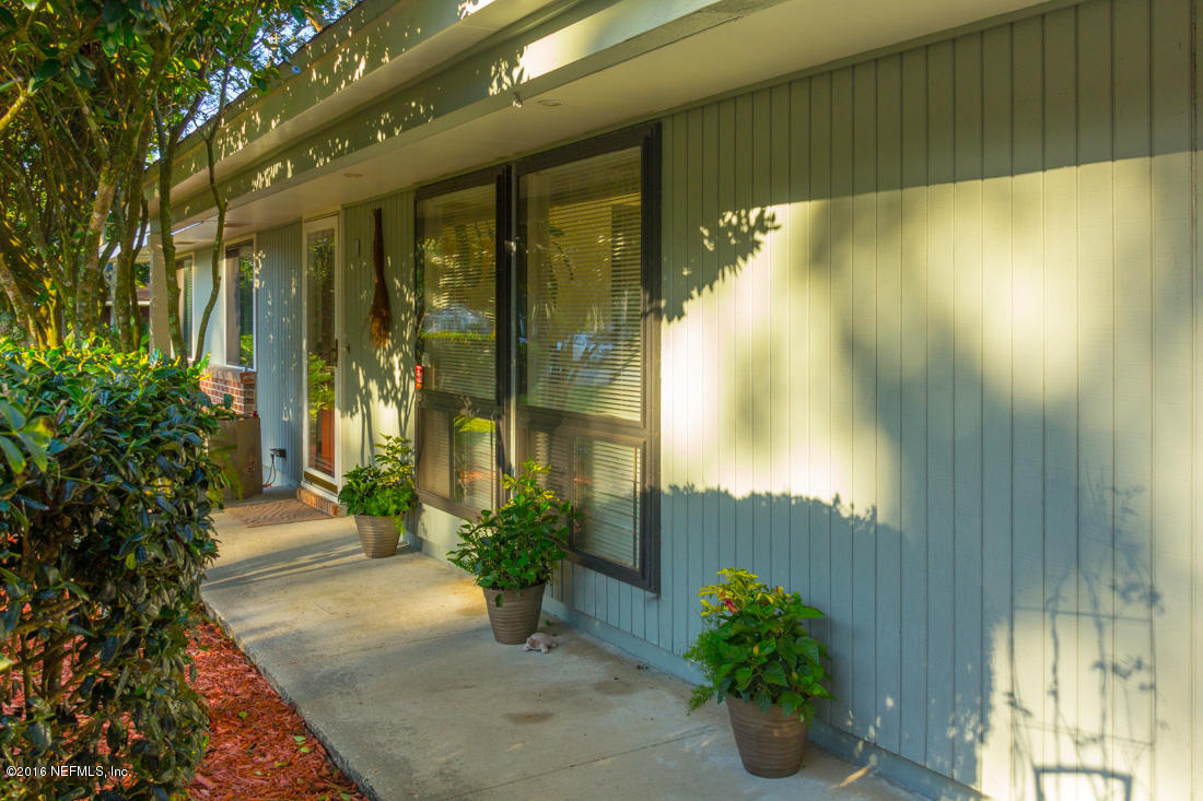 12594 Agatite Road Jacksonville, FL 32258 - Photo 6 of 49 a porch with seating space