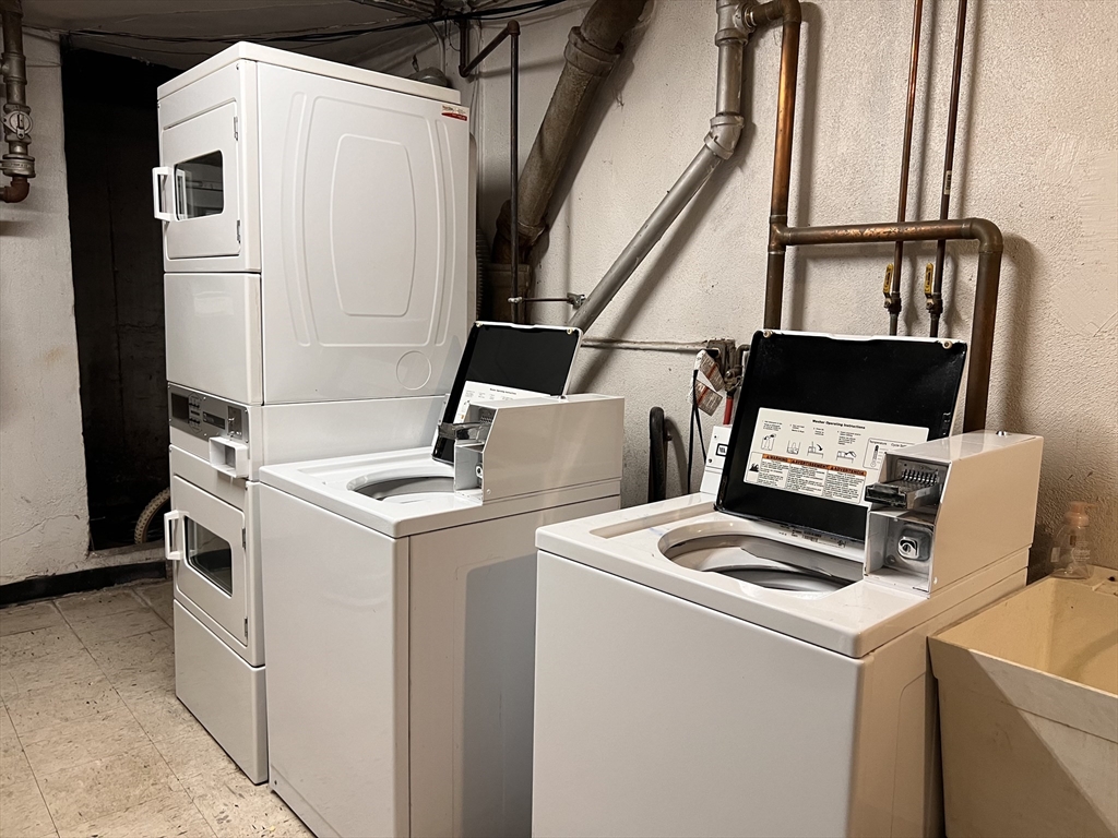 215 Washington Avenue, Unit 9 Chelsea, MA 02150 - Photo 13 of 16 a utility room with dryer and washer