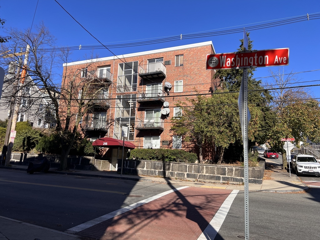 215 Washington Avenue, Unit 9 Chelsea, MA 02150 - Photo 14 of 16 a front view of a building with street view