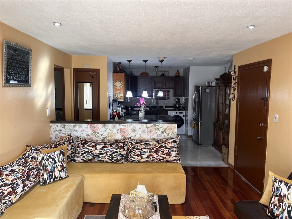 215 Washington Avenue, Unit 9 Chelsea, MA 02150 - Photo 3 of 16 a view of a living room and dining room