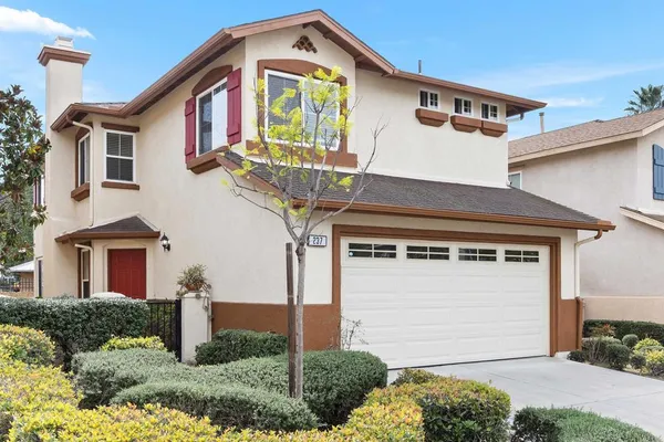 a front view of a house with a garage
