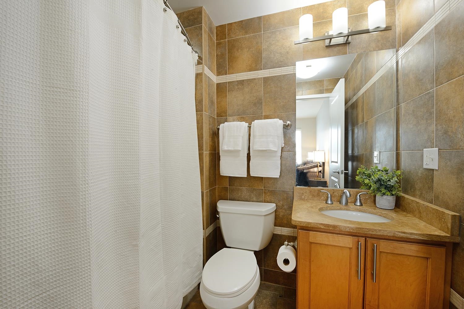 619 Adams Street, Unit 509 Hoboken, NJ 07030 - Photo 20 of 29 a bathroom with a granite countertop sink toilet and shower