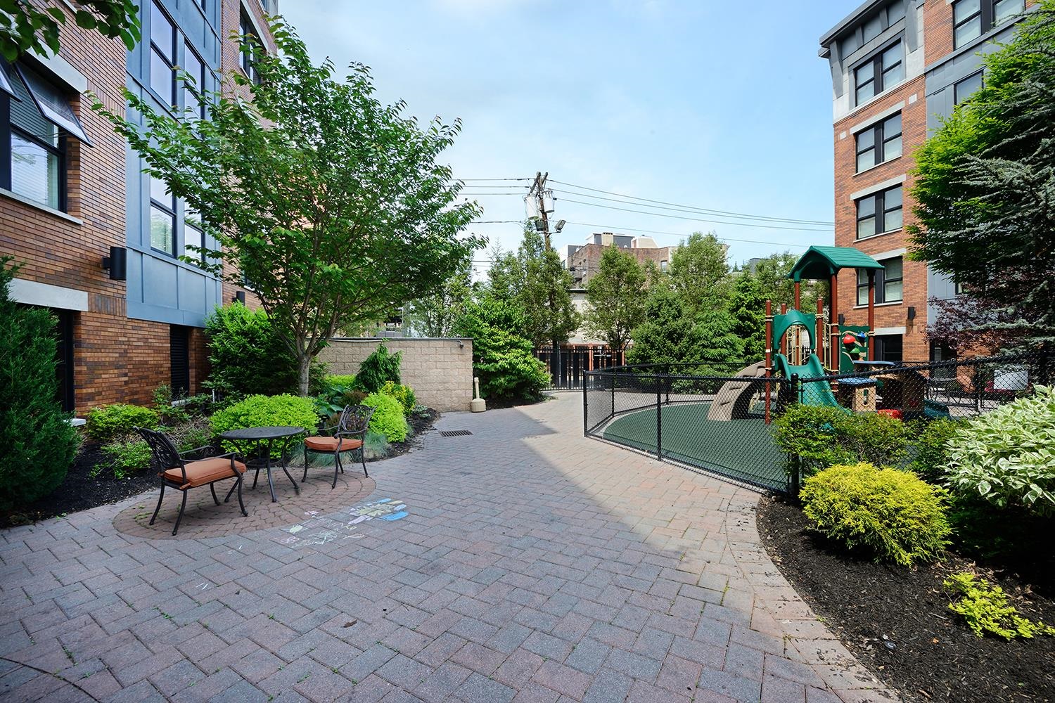 619 Adams Street, Unit 509 Hoboken, NJ 07030 - Photo 24 of 29 a view of a backyard with sitting area and garden