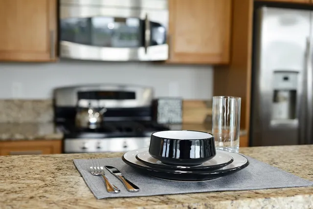 a kitchen with a stove and a microwave