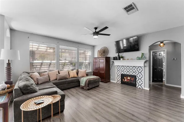 a living room with furniture and a fireplace