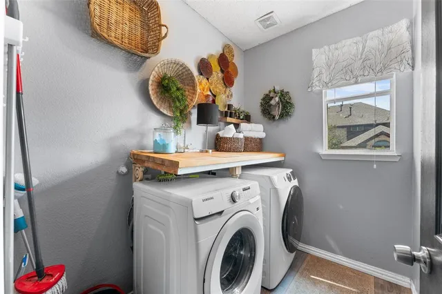a utility room with dryer and washer
