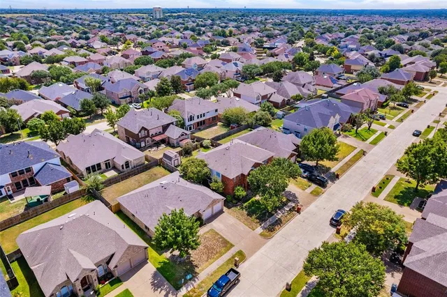 an aerial view of a city with lots of residential buildings