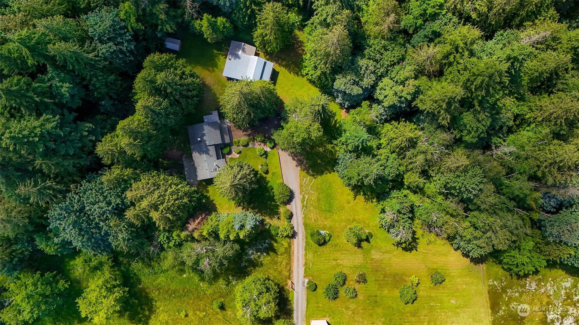 3901 Cabrant Road Everson, WA 98247 - Photo 2 of 40 an aerial view of residential house with swimming pool and lawn chairs