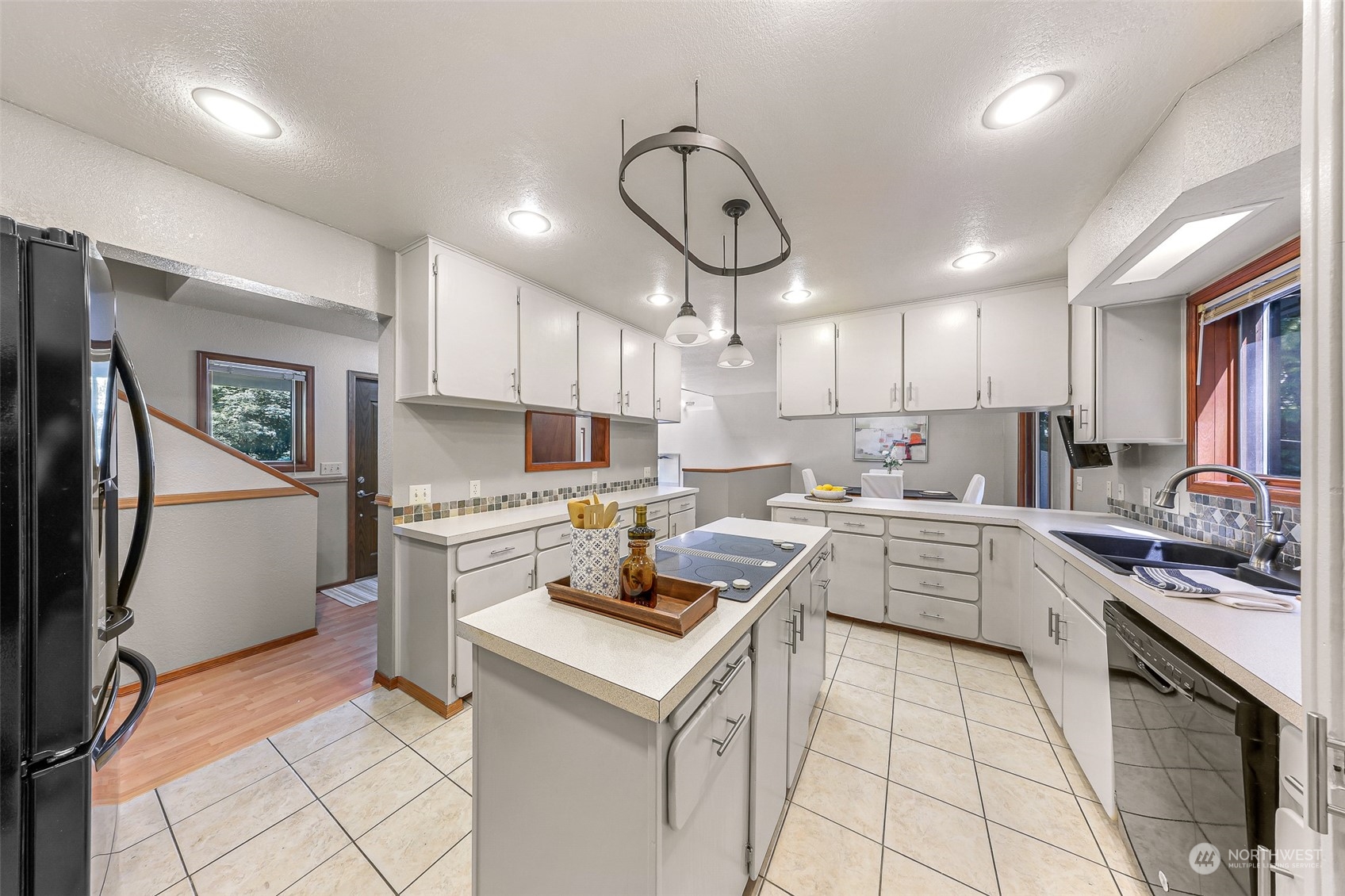 3901 Cabrant Road Everson, WA 98247 - Photo 8 of 40 a kitchen with a sink cabinets and stainless steel appliances