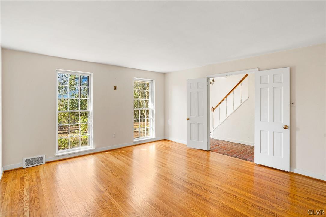 175 Beaumont Road Devon, PA 19333 - Photo 20 of 49 a view of an empty room with wooden floor and a window