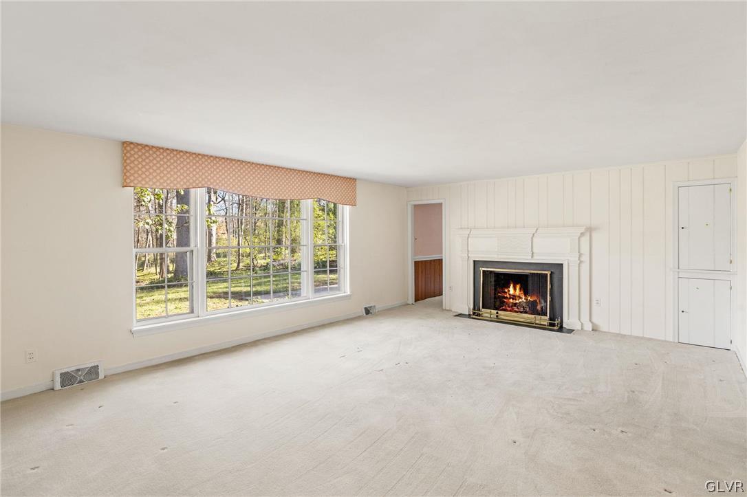 175 Beaumont Road Devon, PA 19333 - Photo 24 of 49 an empty room with fireplace and a window