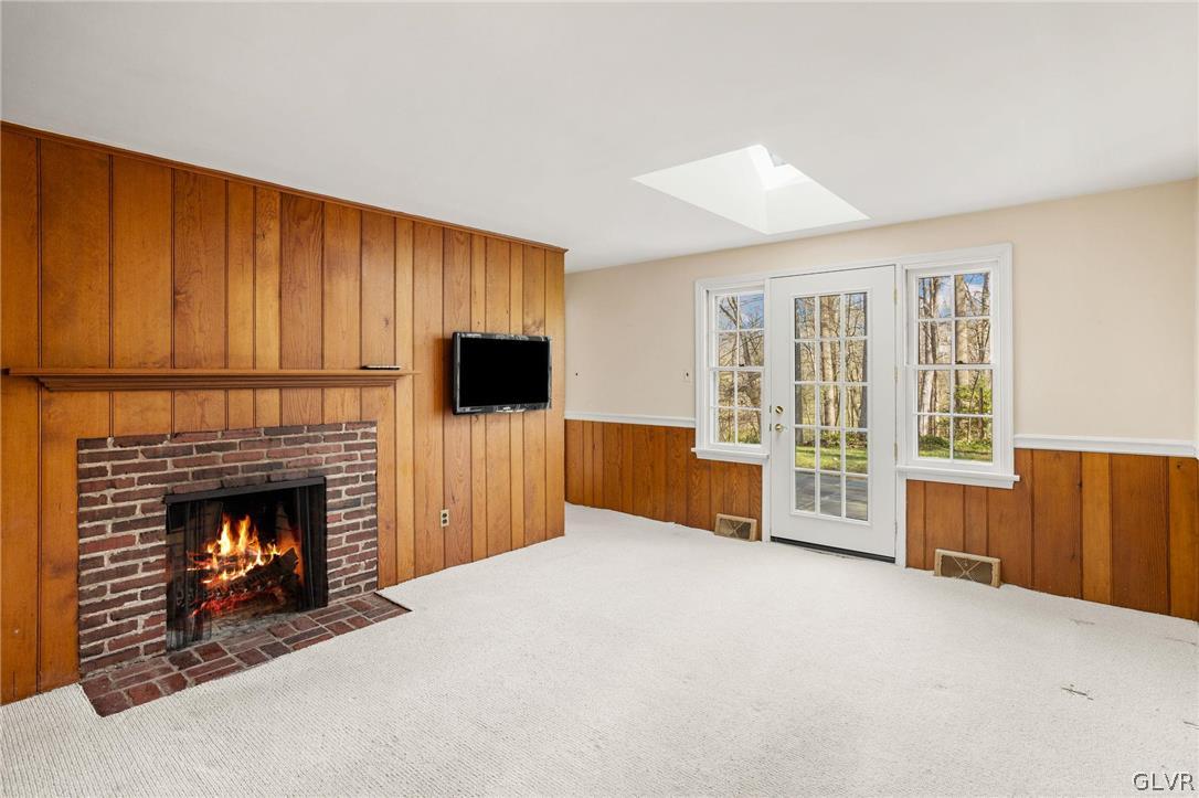 175 Beaumont Road Devon, PA 19333 - Photo 26 of 49 a living room with furniture and a fireplace