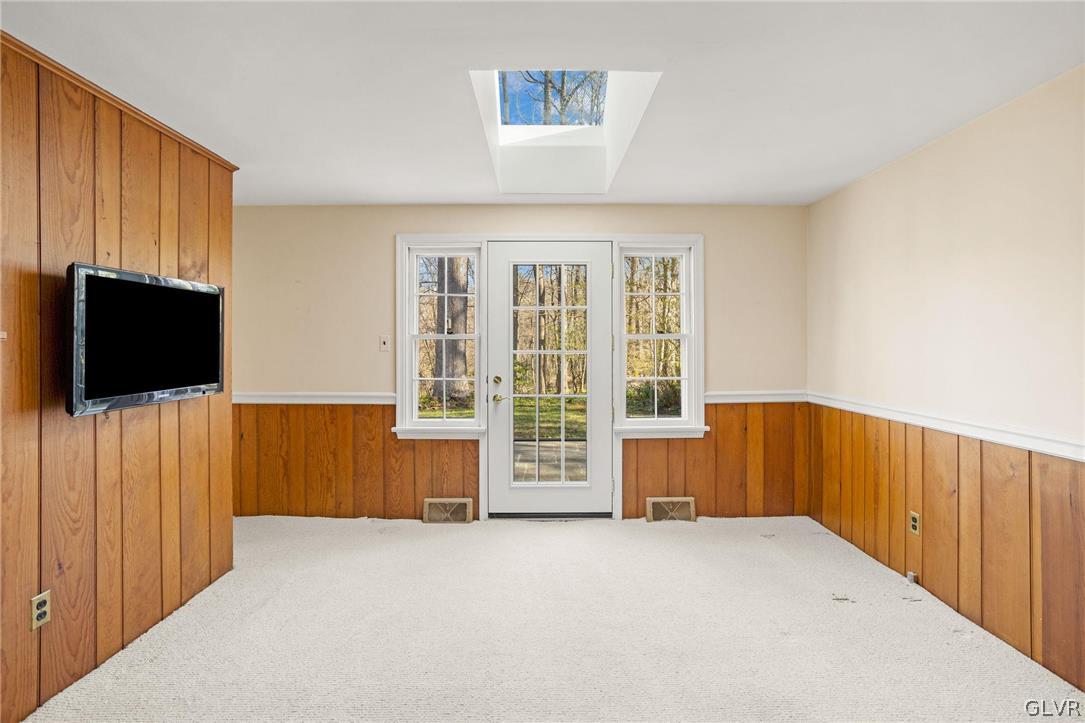 175 Beaumont Road Devon, PA 19333 - Photo 27 of 49 a view of an empty room with furniture and a window