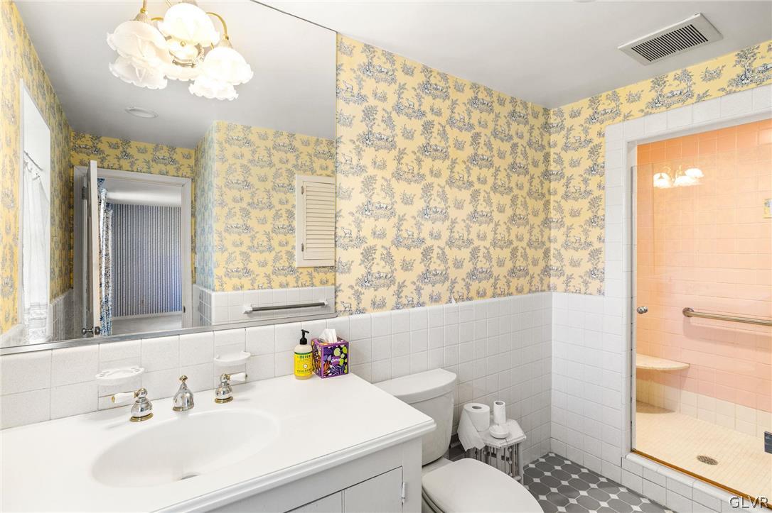 175 Beaumont Road Devon, PA 19333 - Photo 33 of 49 a bathroom with a sink a toilet and a mirror