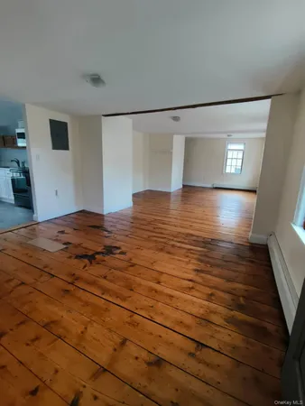 a view of a livingroom with wooden floor