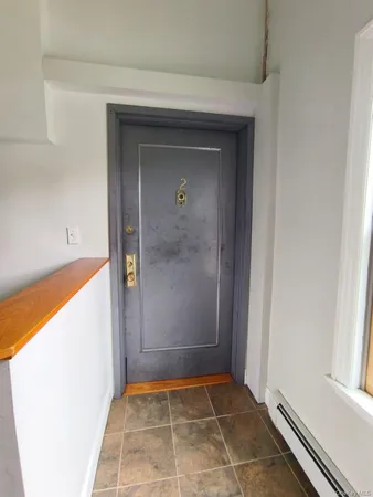 a view of an empty room and window