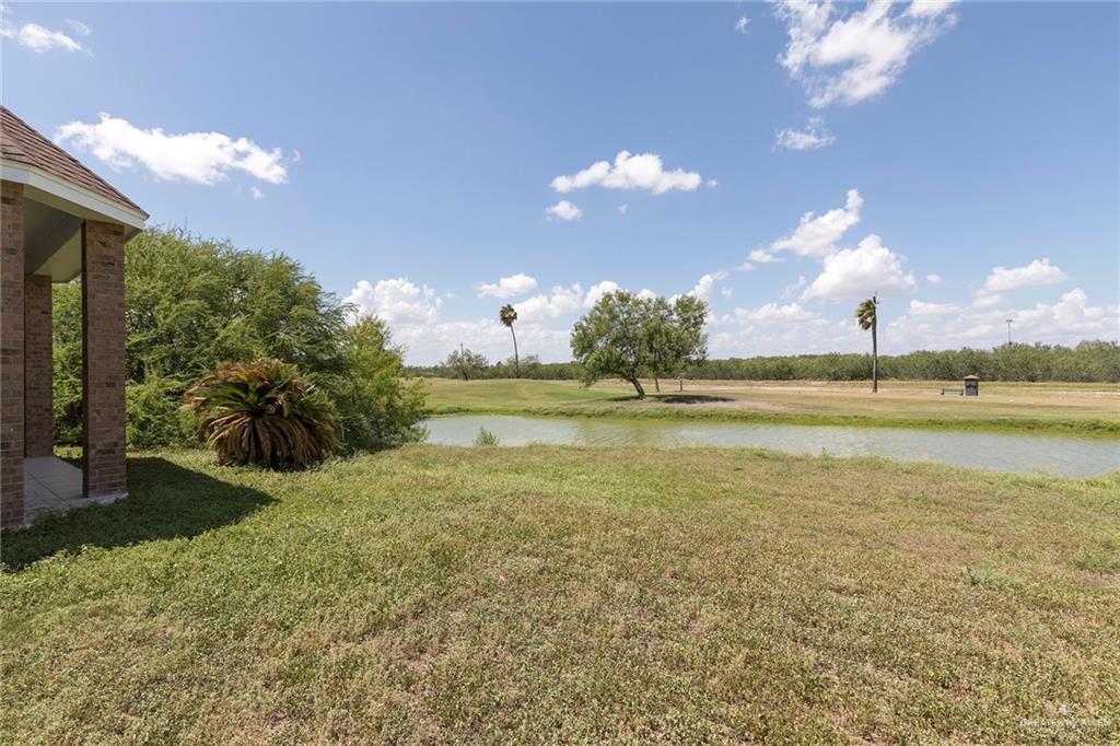 1213 Rhett Drive Pharr, TX 78577 - Photo 19 of 19 Spacious backyard overlooking a tranquil pond and scenic golf course.