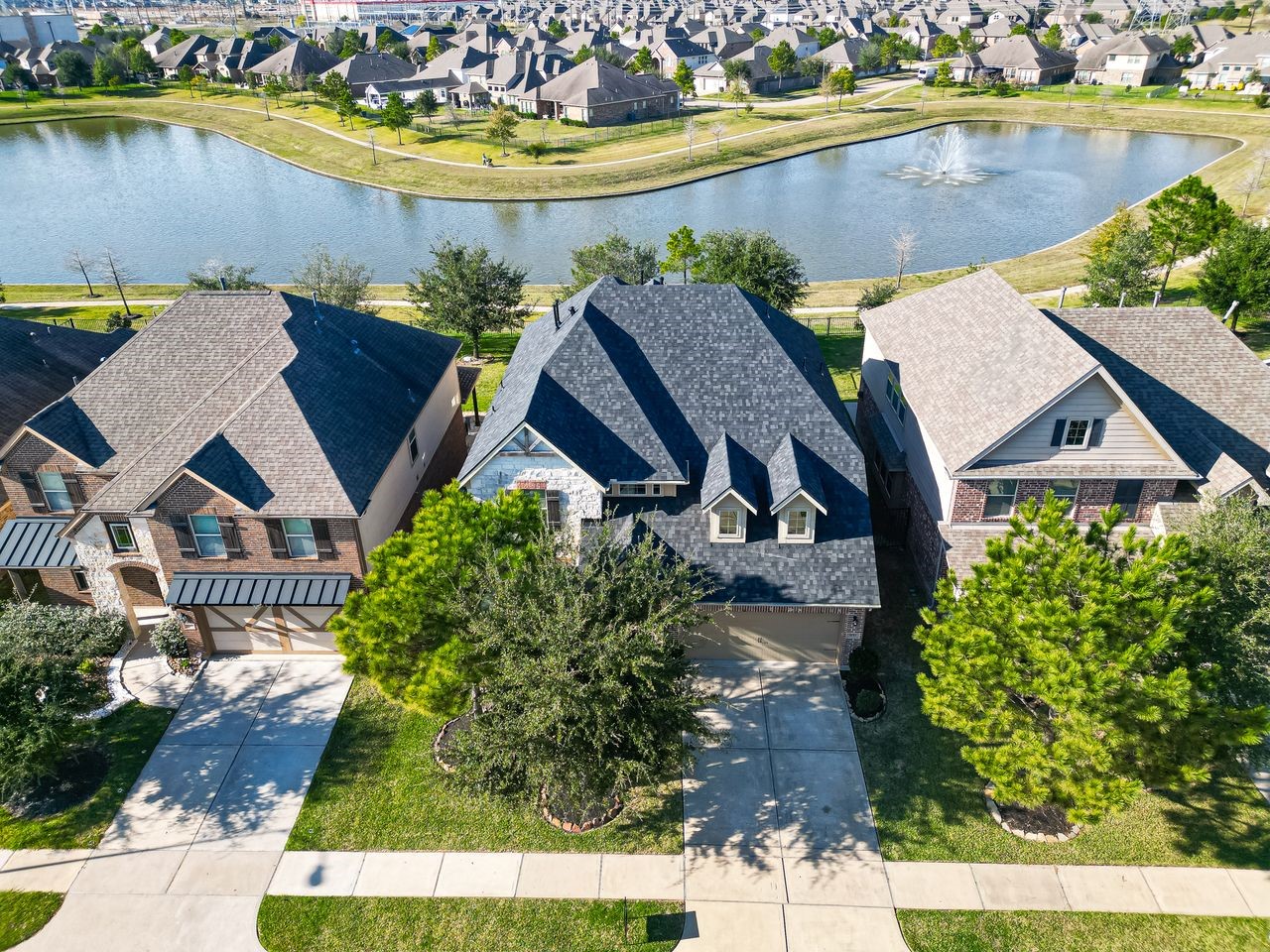 an aerial view of a house with a swimming pool