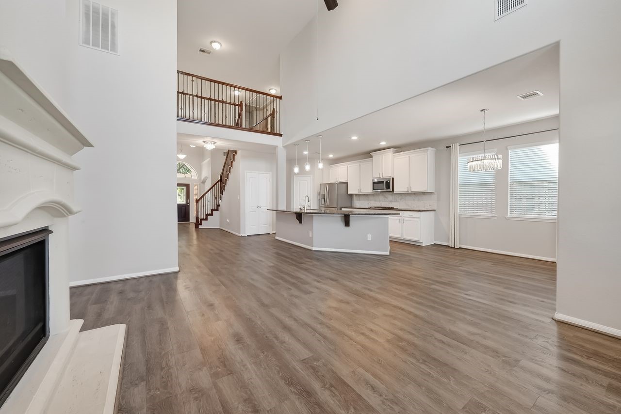 9151 Monarch Field Lane Cypress, TX 77433 - Photo 22 of 48 a view of a kitchen with a sink and a refrigerator