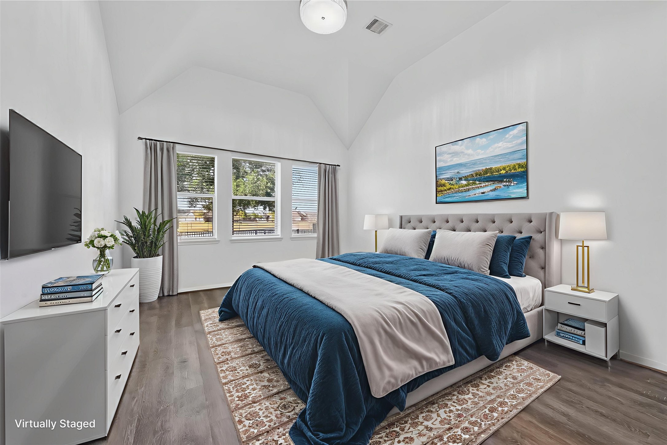 9151 Monarch Field Lane Cypress, TX 77433 - Photo 23 of 48 a bedroom with a large bed and a flat screen tv