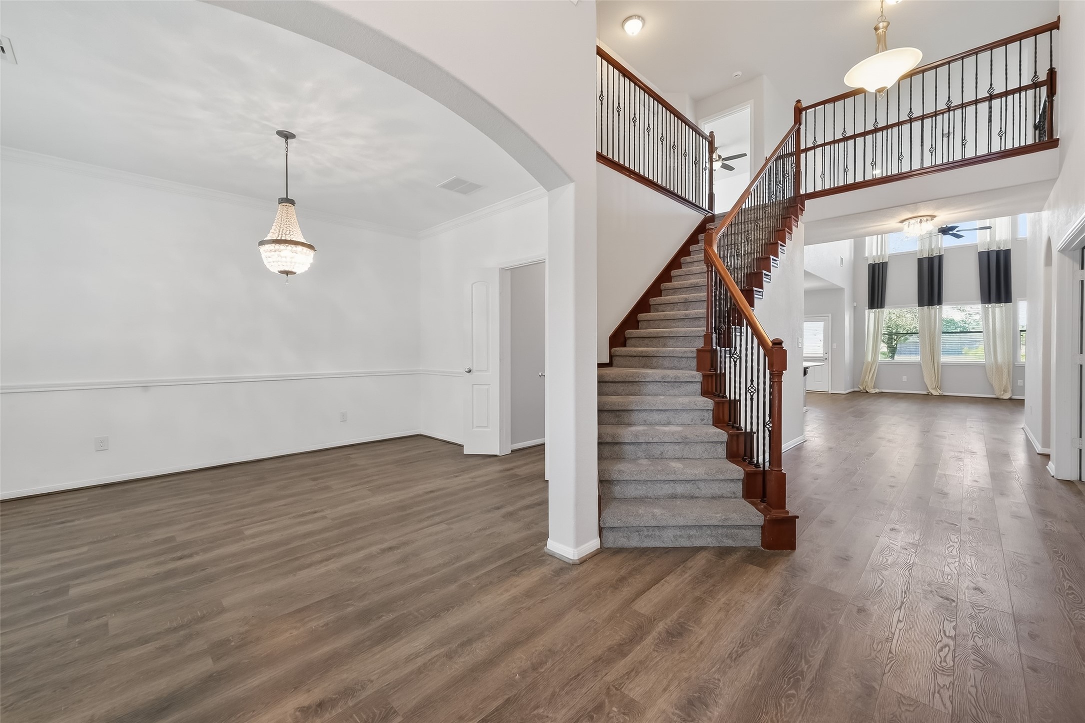 9151 Monarch Field Lane Cypress, TX 77433 - Photo 3 of 48 a view of entryway and hall with wooden floor