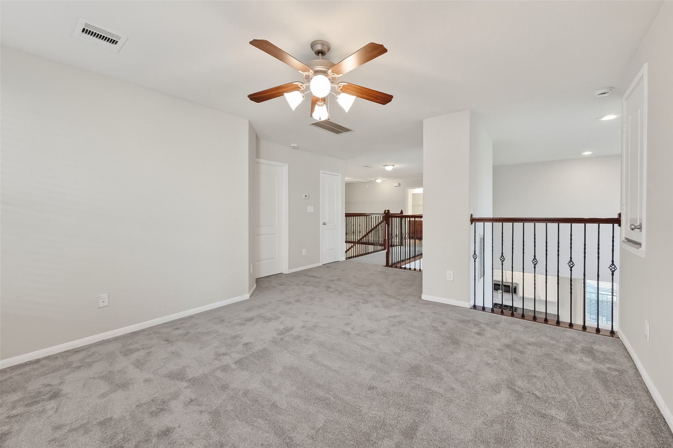 9151 Monarch Field Lane Cypress, TX 77433 - Photo 32 of 48 en view of empty room with a ceiling fan
