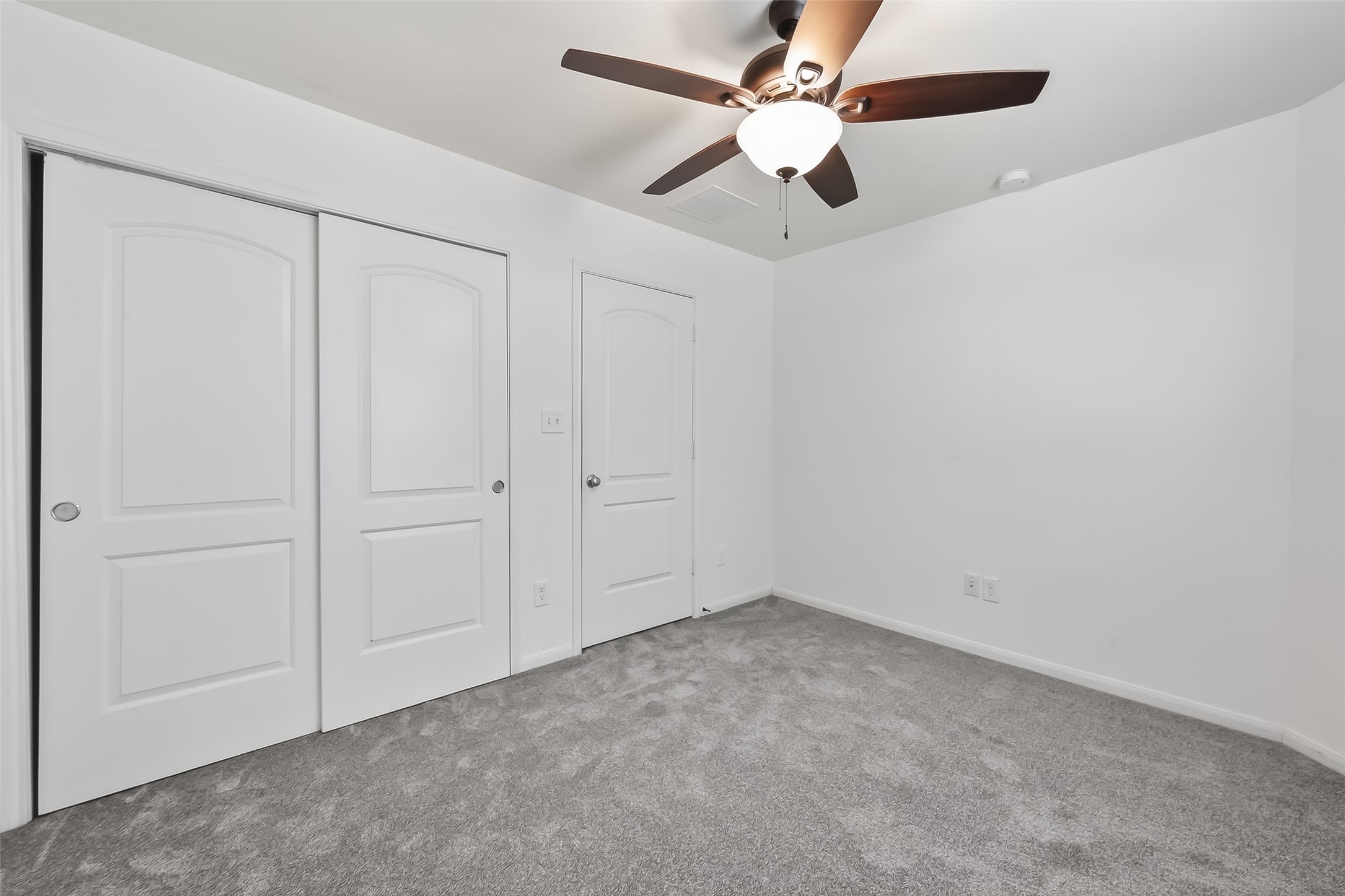 9151 Monarch Field Lane Cypress, TX 77433 - Photo 35 of 48 an empty room with a ceiling fan