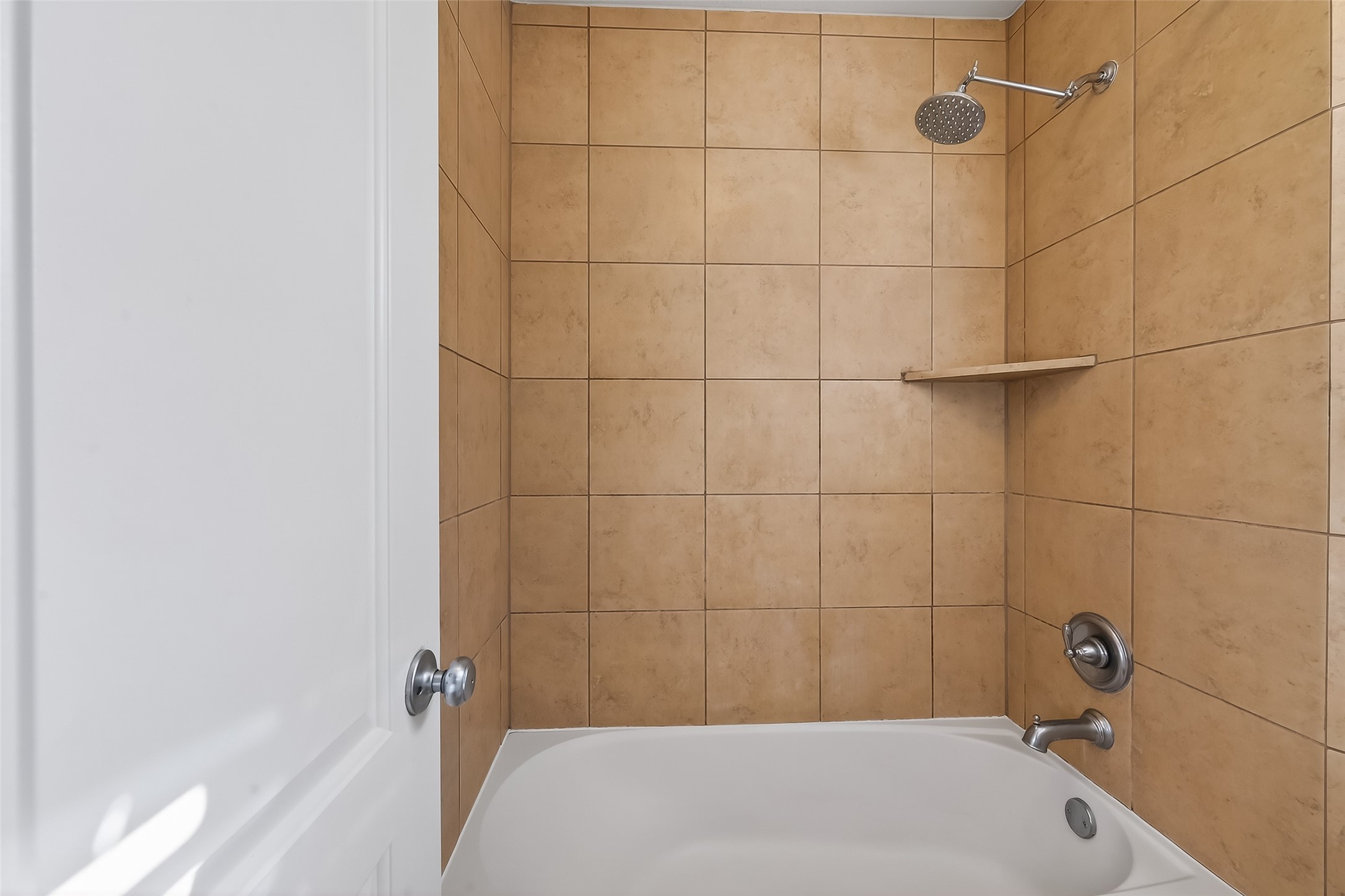 9151 Monarch Field Lane Cypress, TX 77433 - Photo 37 of 48 a bathroom with a bath tub