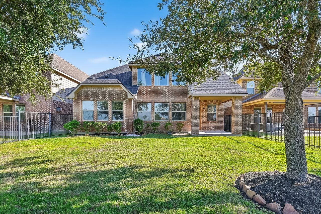 9151 Monarch Field Lane Cypress, TX 77433 - Photo 44 of 48 a front view of a house with a yard