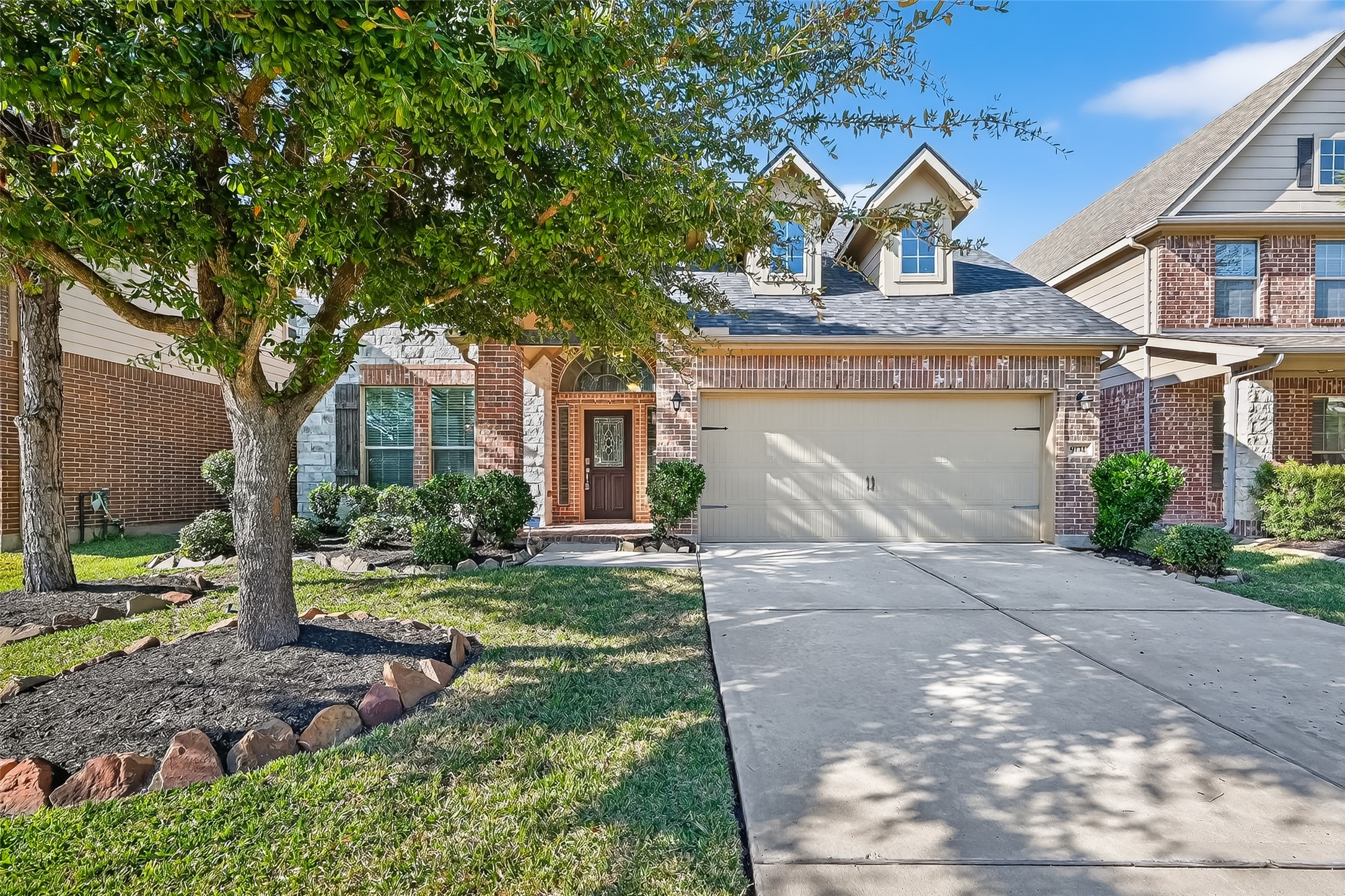 9151 Monarch Field Lane Cypress, TX 77433 - Photo 5 of 48 a front view of a house with garden