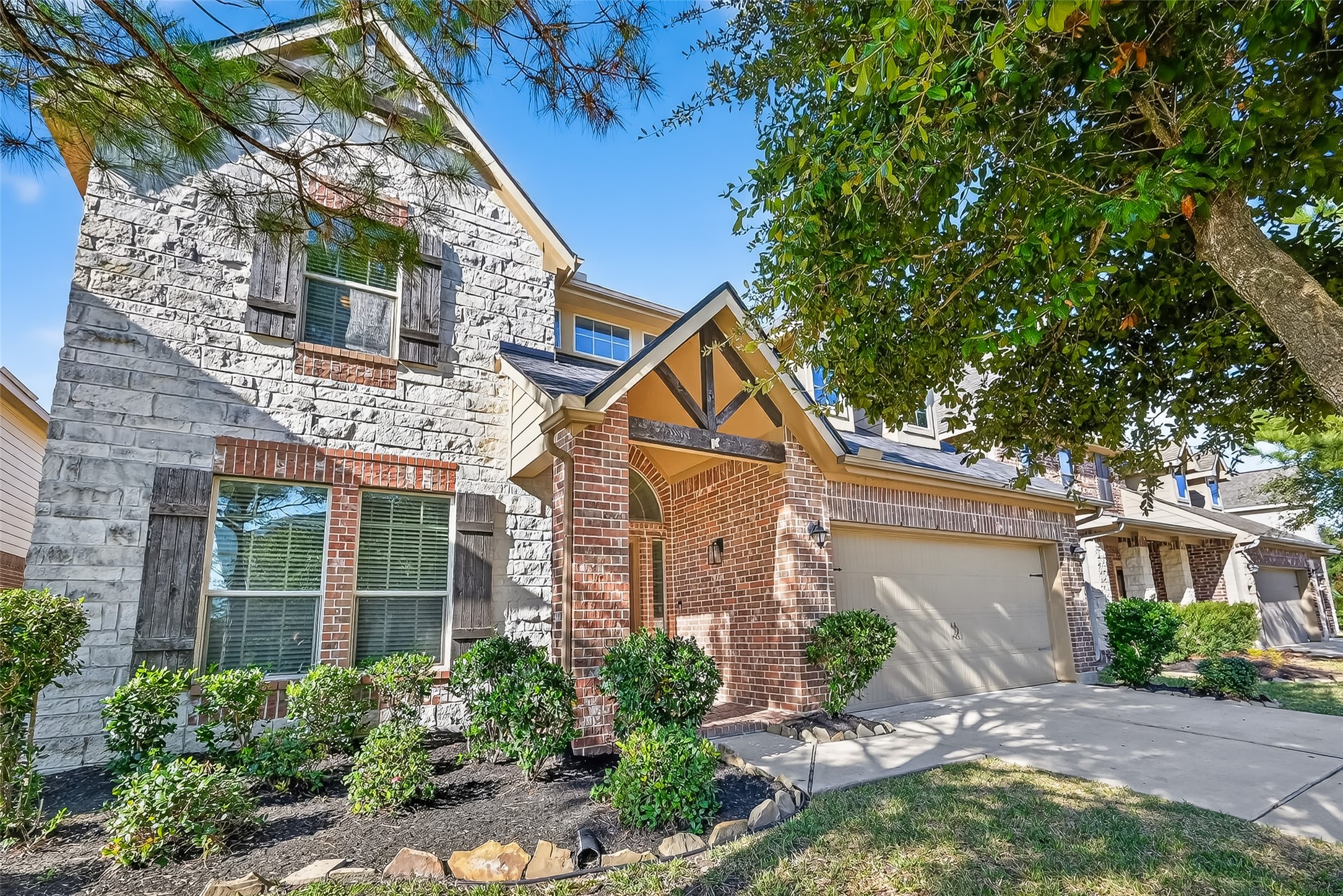9151 Monarch Field Lane Cypress, TX 77433 - Photo 7 of 48 a front view of a house with garden