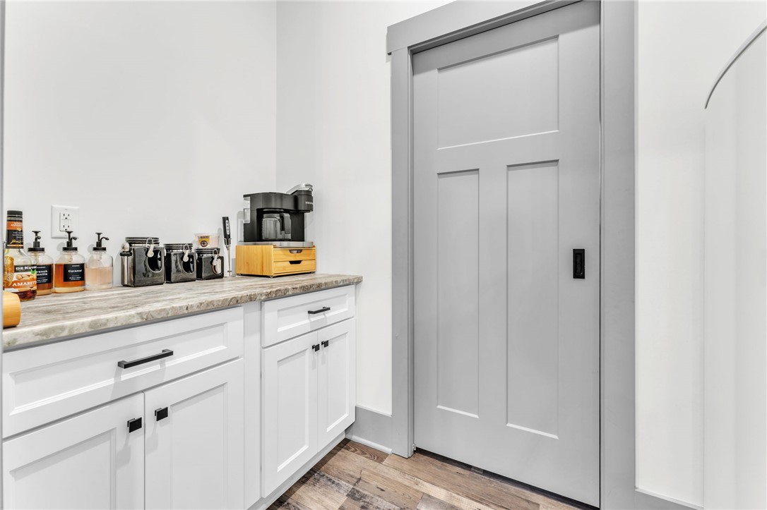919 Watercrest Road West Union, SC 29696 - Photo 13 of 50 This thoughtfully designed pantry provides practical storage and seamless kitchen access. Through this door is a Butler's pantry for added space.