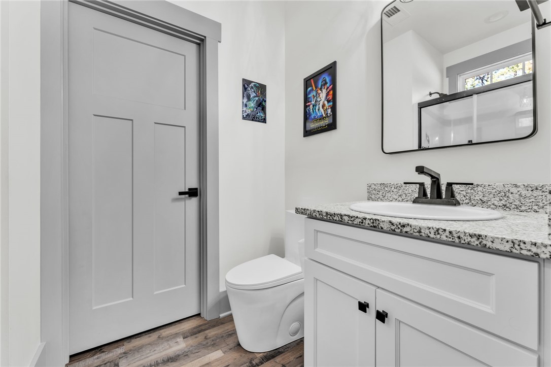 919 Watercrest Road West Union, SC 29696 - Photo 14 of 50 This clean and bright bathroom features a modern vanity and practical amenities.