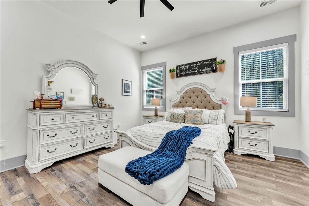919 Watercrest Road West Union, SC 29696 - Photo 15 of 50 This spacious bedroom features ample natural light and elegant wood flooring.