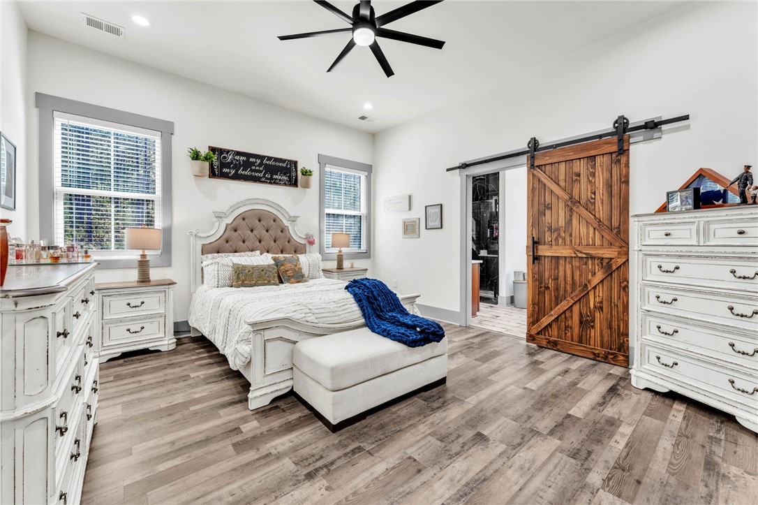 919 Watercrest Road West Union, SC 29696 - Photo 17 of 50 This spacious bedroom features ample natural light and direct access to a private bathroom.
