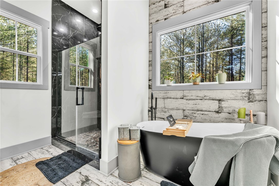 919 Watercrest Road West Union, SC 29696 - Photo 18 of 50 This bathroom offers a tranquil retreat with a freestanding tub and spacious shower.