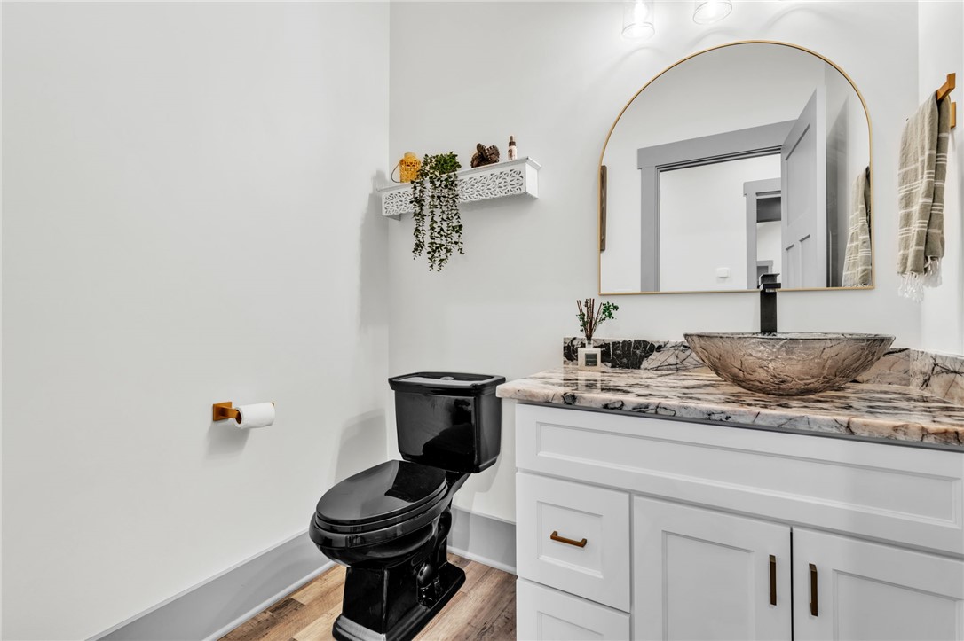 919 Watercrest Road West Union, SC 29696 - Photo 25 of 50 This bathroom boasts sleek black fixtures, a stylish vessel sink, and a spacious vanity with elegant countertops.