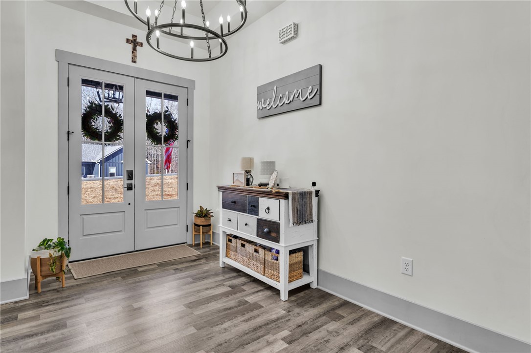 919 Watercrest Road West Union, SC 29696 - Photo 3 of 50 This entry features elegant glass panel doors and durable wood flooring.